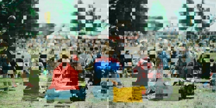 group of people on grass field under sunny day